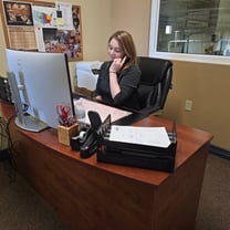 A CCF representative working at their desk
